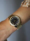 Guess Sparkler Diamonds Black Dial Gold Steel Strap Watch for Women - GW0111L2